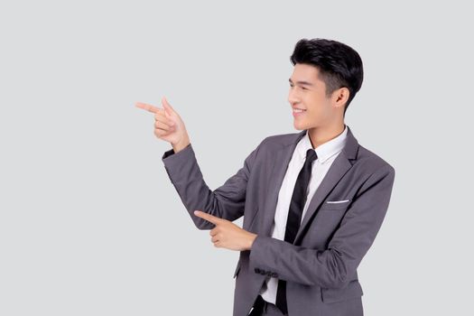 Portrait young asian business man pointing and presenting isolated on white background, advertising and marketing, executive and manager, male confident showing success, expression and emotion.