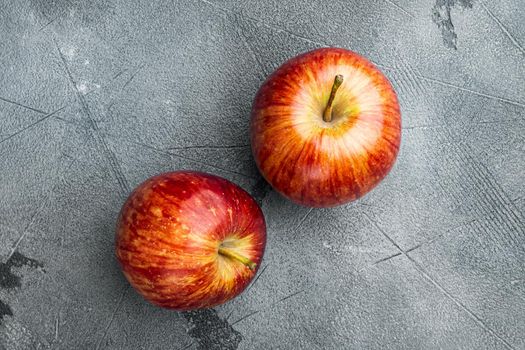 Ripe red apples, on gray stone table background, top view flat lay, with copy space for text