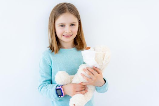 Little girl with plush teddy