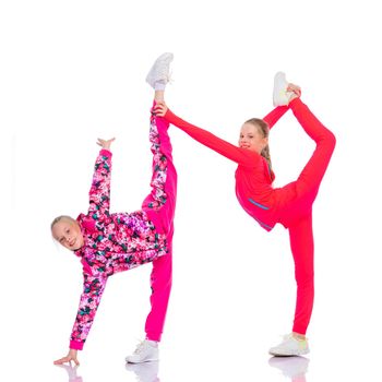 Girls gymnasts perform exercises.