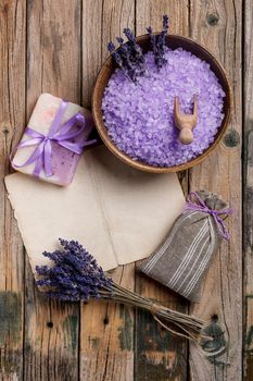 Spa advertisement with lavender salt, soap and sachet