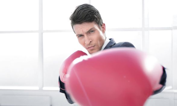 confident young businessman in Boxing gloves
