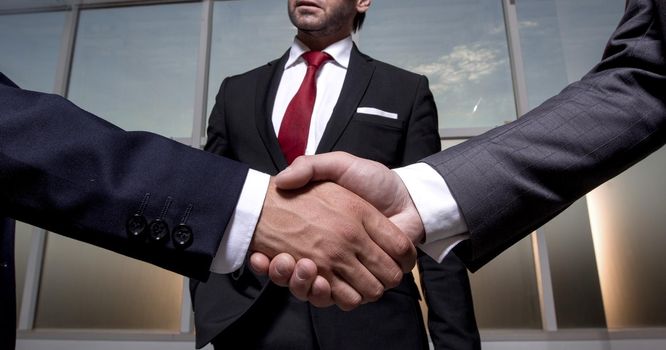 business partners shake hands