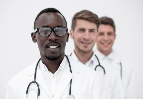 group of multi-racial doctors standing in a row