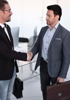 welcoming handshake of a businessman with a lawyer