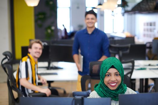 Multiethnic startup business team with Arabian woman