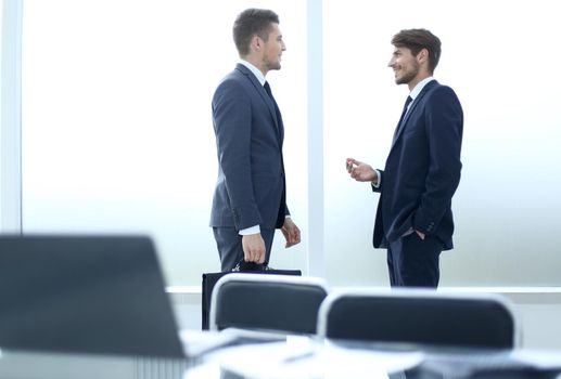 businessmen discuss an office deal