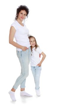 Mom and daughter in jeans white shirts