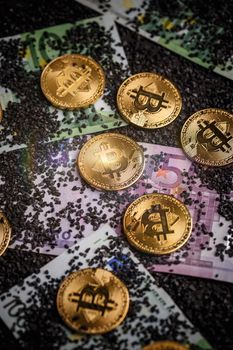 Golden bitcoins on euro banknotes
