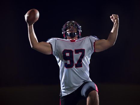 american football player celebrating after scoring a touchdown