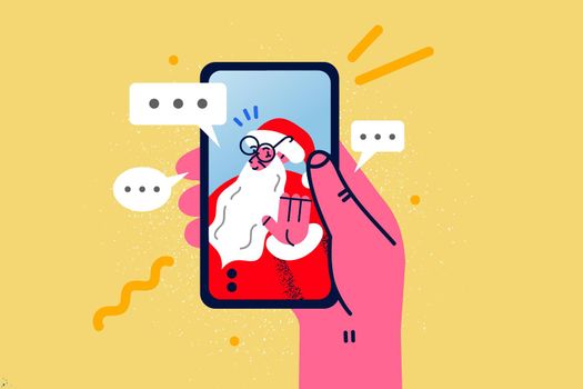 Person talk on video call with Santa on cellphone