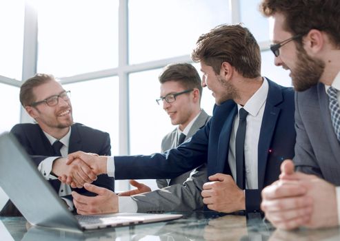 business colleagues confirm their success with a handshake