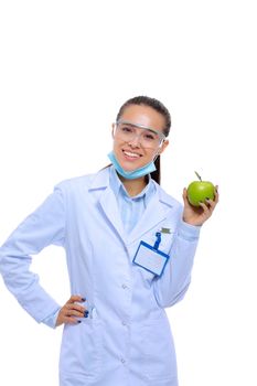 Dentist medical doctor woman hold green fresh apple in hand and tooth brush. Dentist doctors. Woman doctors
