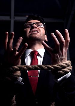 close up.screaming businessman with his hands tied