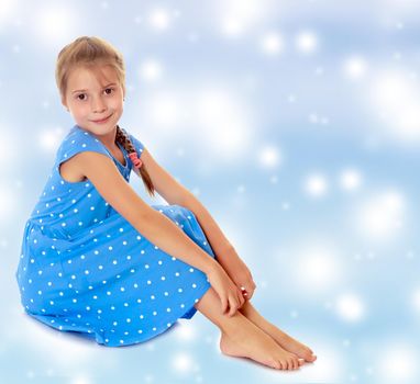 Little girl in a blue dress
