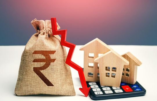 Indian rupee money bag with down arrow and houses on calculator. Saving resources and reducing maintaining cost, increasing energy efficiency. Falling real estate market, low prices and demand.