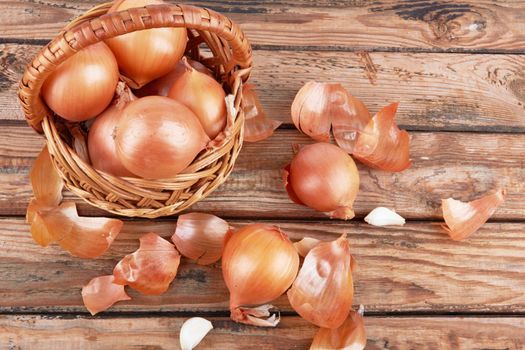 Onions on wooden background