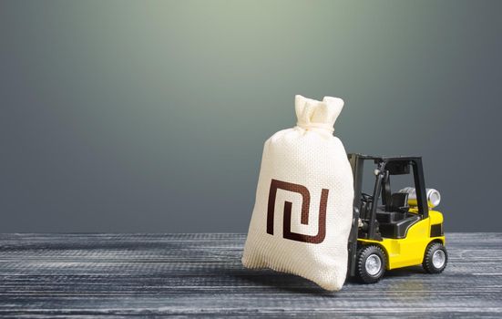 Forklift transports a israeli shekel money bag. Attraction of investments in business and economy, cheap loans, leasing. Crisis recovery measures. Borrowing on capital market. Stimulating economy.