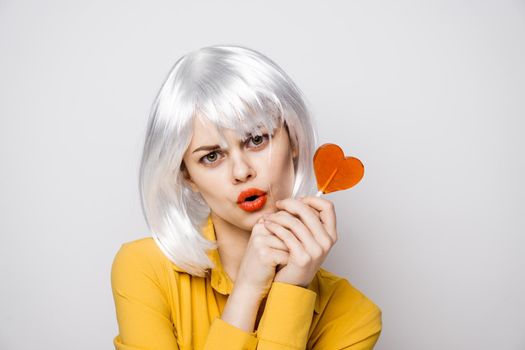 beautiful woman in white wig lollipop fashion. High quality photo