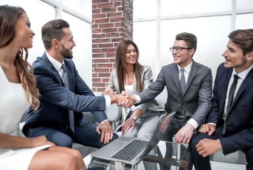 handshake business people at an informal meeting