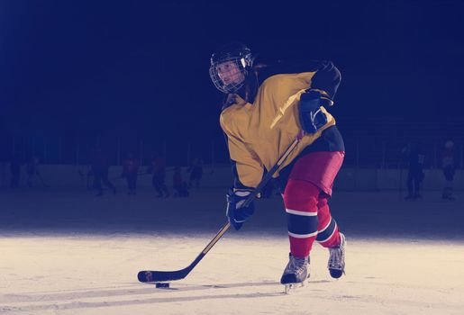 teen ice hockey player in action