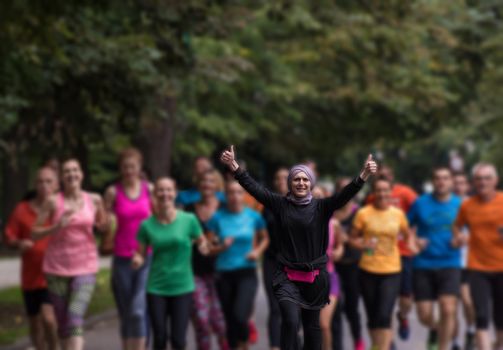 muslim woman with her runners team jogging