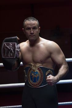 kick boxer with his championship belt