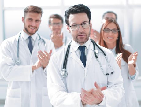 successful doctor, accepting congratulations from colleagues