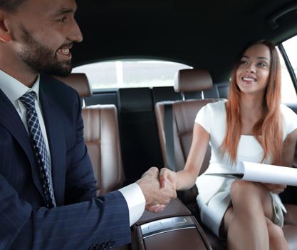 Businessman was congratulated in the car for completing the job