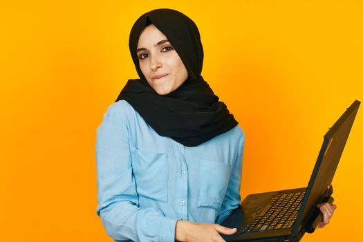 arab woman with laptop in hands technology emotions ethnicity model