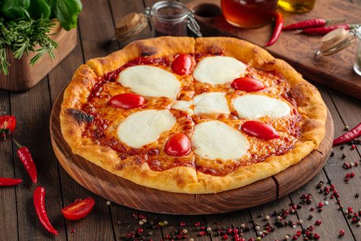 Pizza with mozzarella cheese and tomatoes