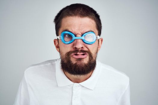 man wearing goggles for swimming emotions fun close-up