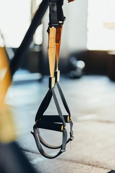 Functional training equipment and sport accessories. Close up shot of fitness trx straps