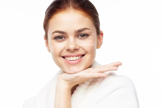 pretty woman in white robe face skin care collagen