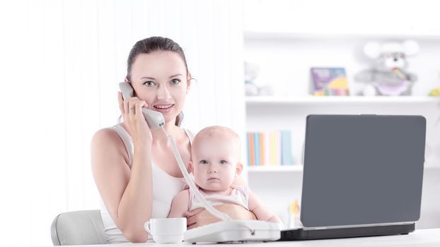 young mother talking on the phone. the concept of freelancing