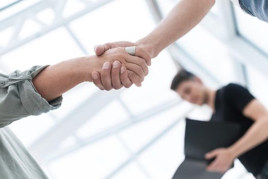 close up. business handshake over blurry background