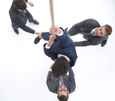 top view .business team helps the leader to climb up.