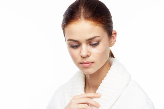pretty woman in white robe face skin care collagen