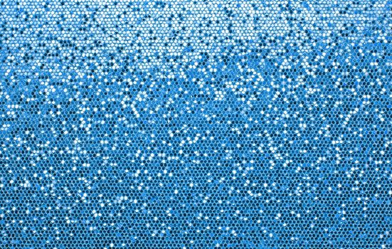 Abstract background texture of blue glitter