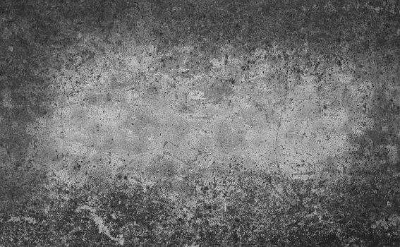 Grunge grey uneven stone surface texture background with dark stains vignette frame
