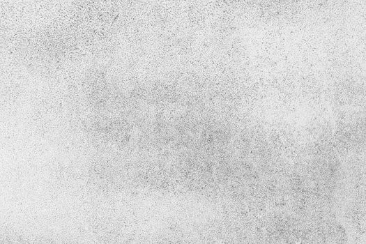 Grunge grey uneven concrete surface texture background with black stains
