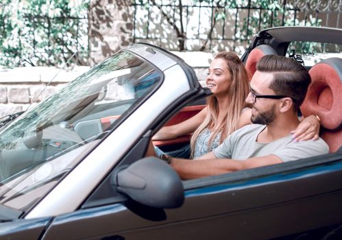 couple in love in a convertible car