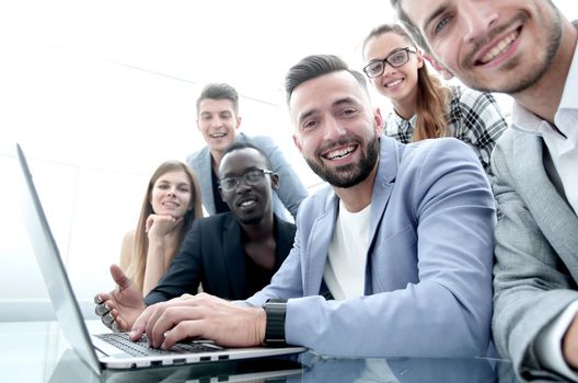 Happy smiling multi-ethnic creative millennial team excited by online result or growth