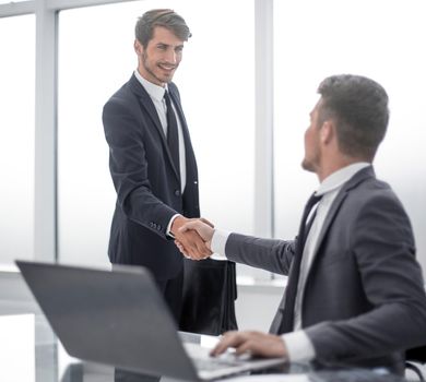 Two businessmen shake hands