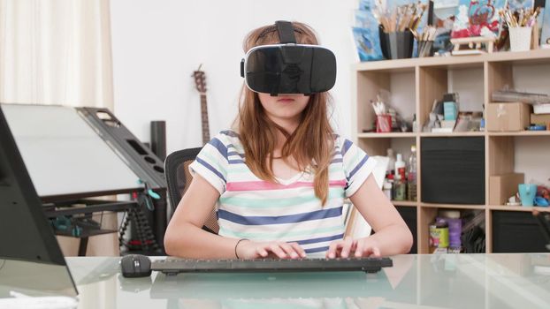 Young child with virtual reality headset playing space shooter videogames