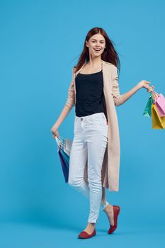 beautiful woman with packages in hands Shopaholic isolated background