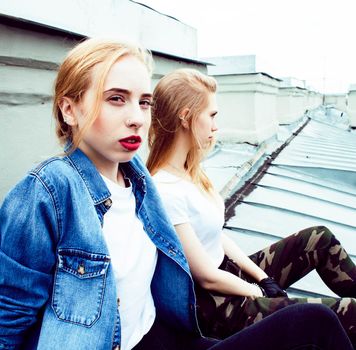 two cool blond real girls friends making selfie on roof top, lifestyle people concept, modern teens closeup