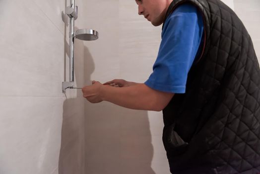 professional plumber working in a bathroom