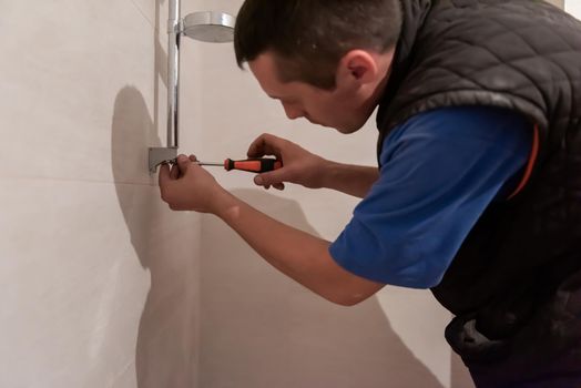 professional plumber working in a bathroom