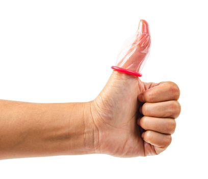Finger under pink condom isolated on a white background.
